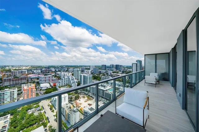 a view of ocean with a multi story building