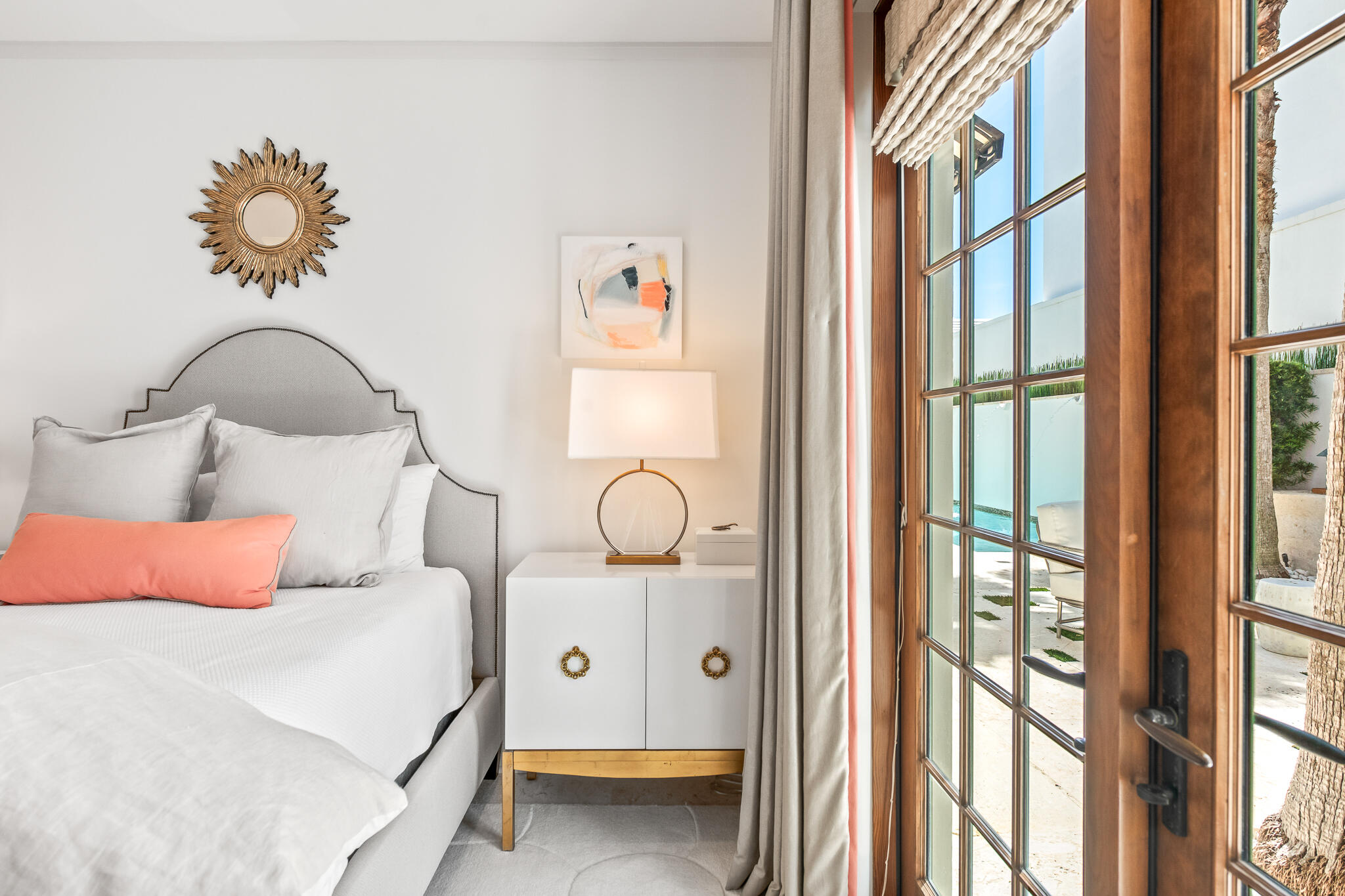 101 Charles Street Inlet Beach, FL 32461 - Photo 26 of 59 a bedroom with a large bed and a chandelier next to a window