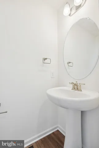a bathroom with a sink a mirror and vanity