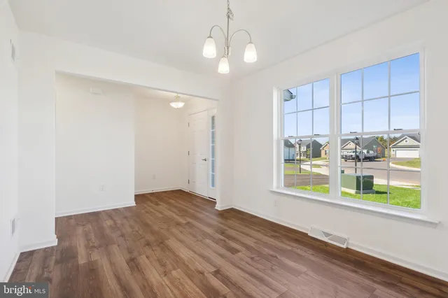 a view of livingroom with furniture wooden floor and window