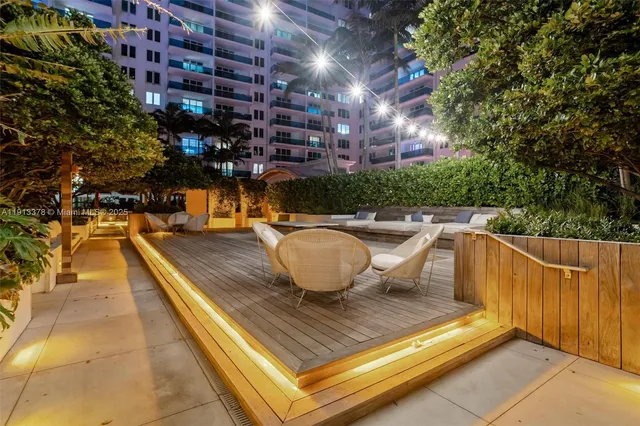 a balcony with furniture and view of city