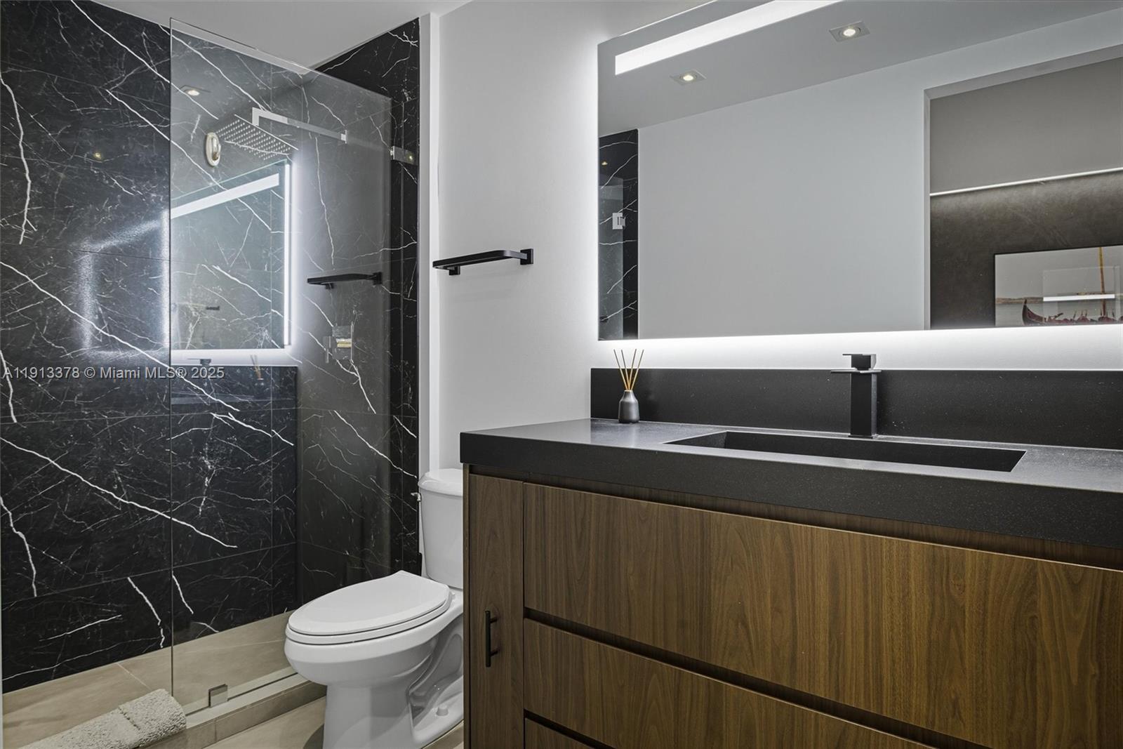 2301 Collins Avenue, Unit 1634 Miami Beach, FL 33139 - Photo 27 of 56 a bathroom with a sink toilet and shower