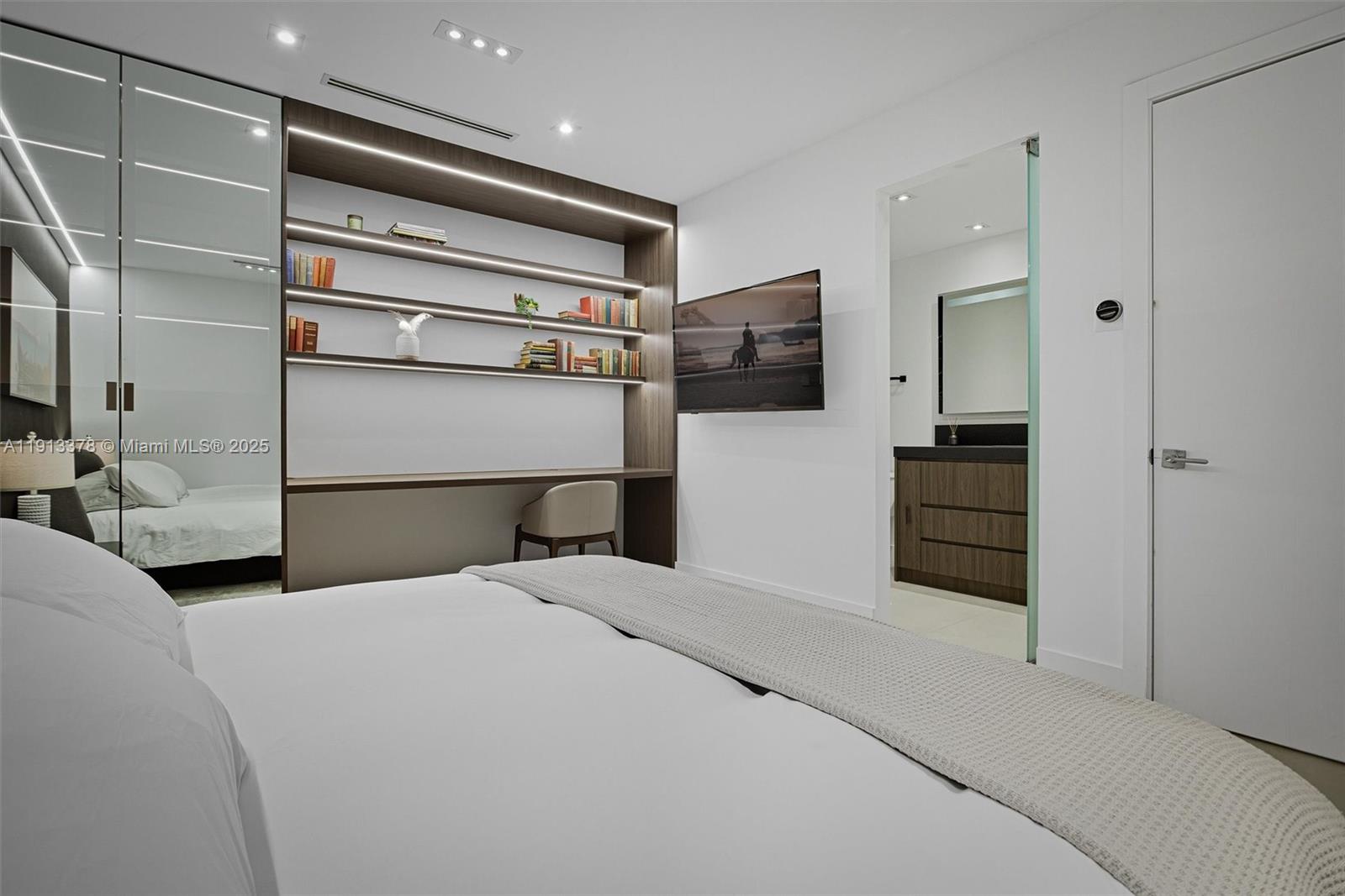 2301 Collins Avenue, Unit 1634 Miami Beach, FL 33139 - Photo 29 of 56 a bedroom with a bed and walk in closet