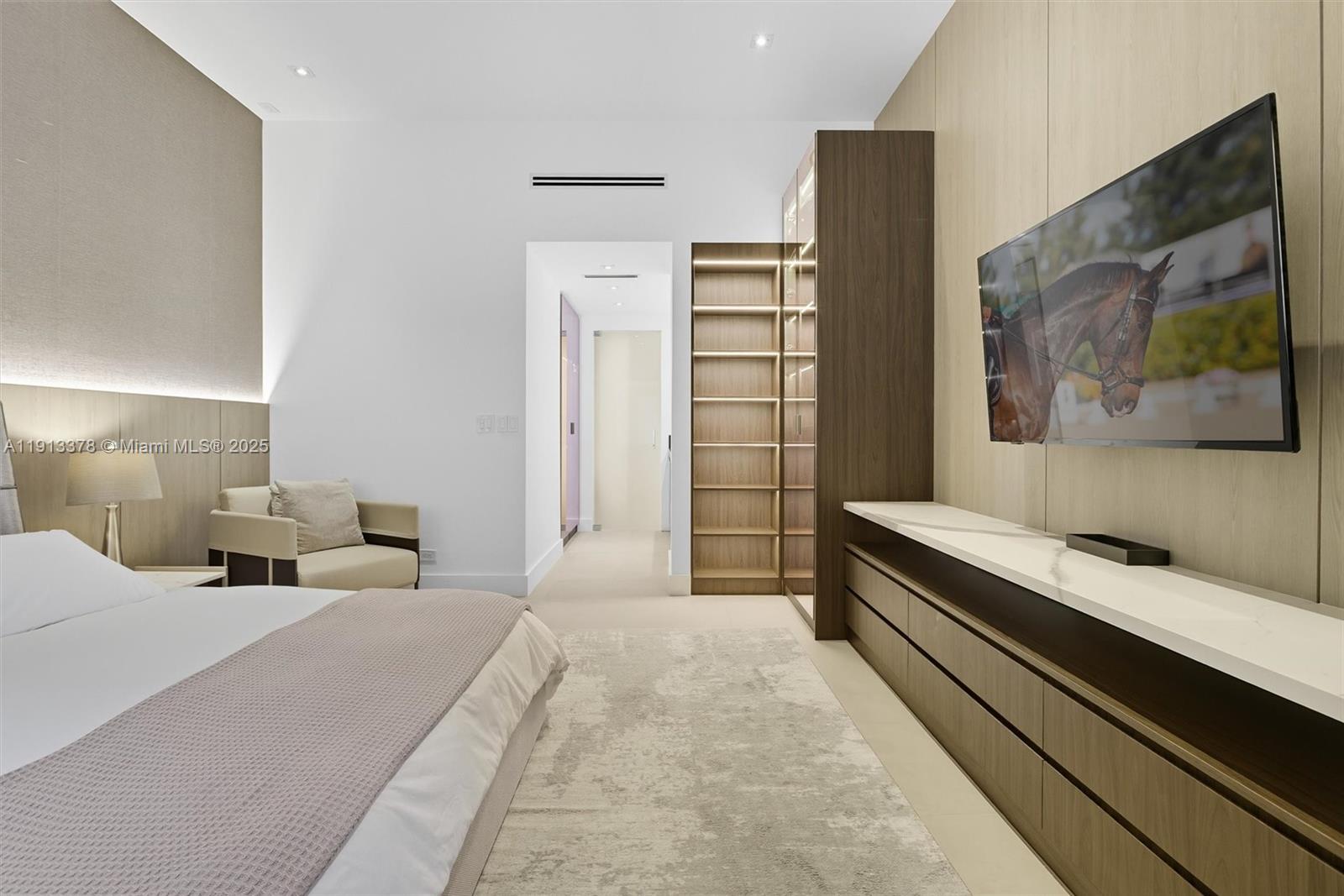 2301 Collins Avenue, Unit 1634 Miami Beach, FL 33139 - Photo 36 of 56 a bedroom with a bed and a painting on the wall