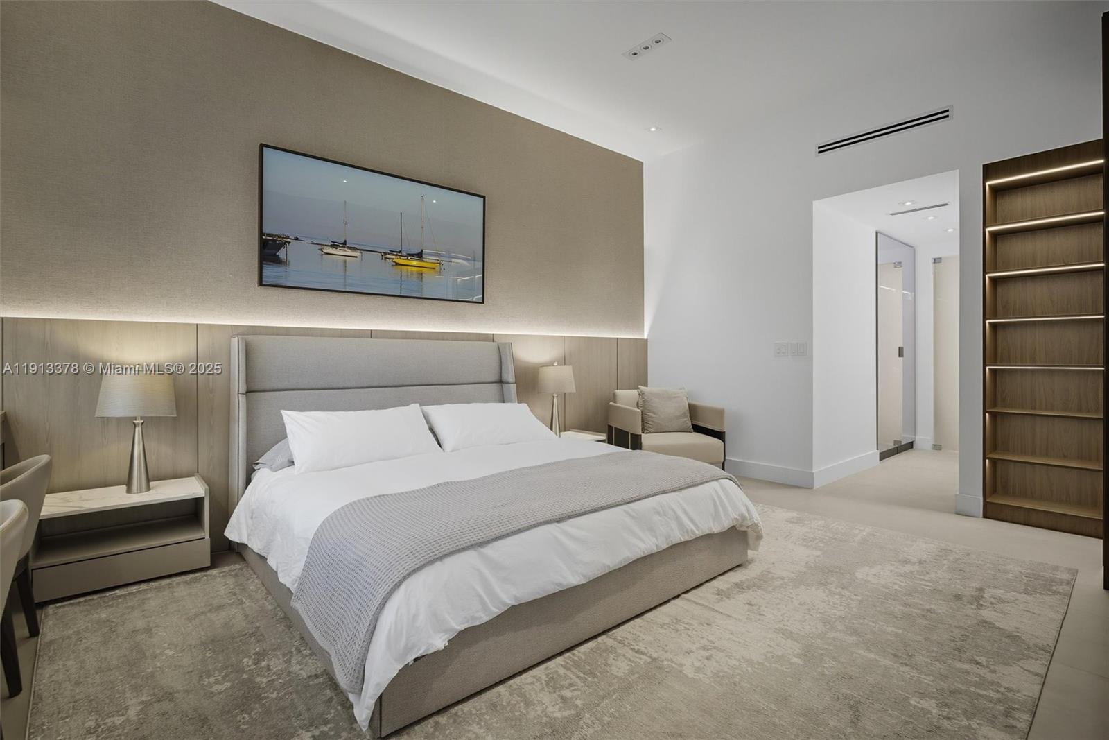 2301 Collins Avenue, Unit 1634 Miami Beach, FL 33139 - Photo 37 of 56 a bedroom with a bed and a painting on the wall