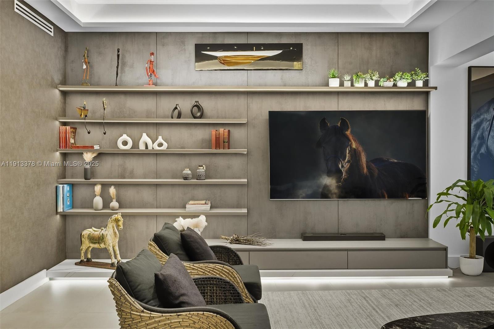 2301 Collins Avenue, Unit 1634 Miami Beach, FL 33139 - Photo 39 of 56 a living room with furniture and a fireplace