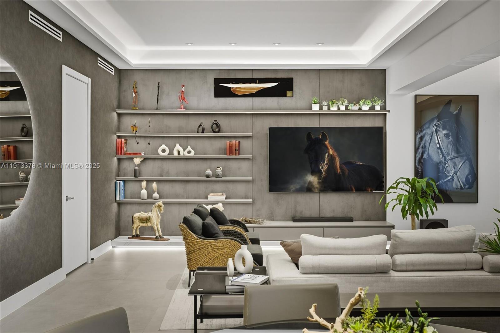 2301 Collins Avenue, Unit 1634 Miami Beach, FL 33139 - Photo 40 of 56 a living room with furniture and a wall painting