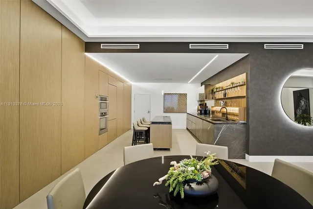 a dining room with furniture a window and kitchen view