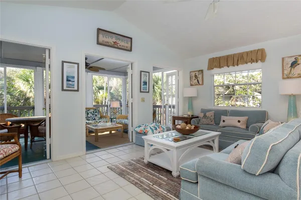 a dining room filled with furniture and window