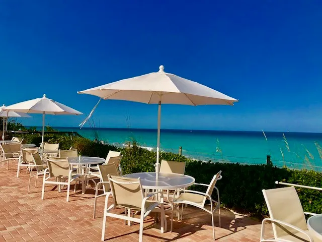 a view of a balcony with chairs