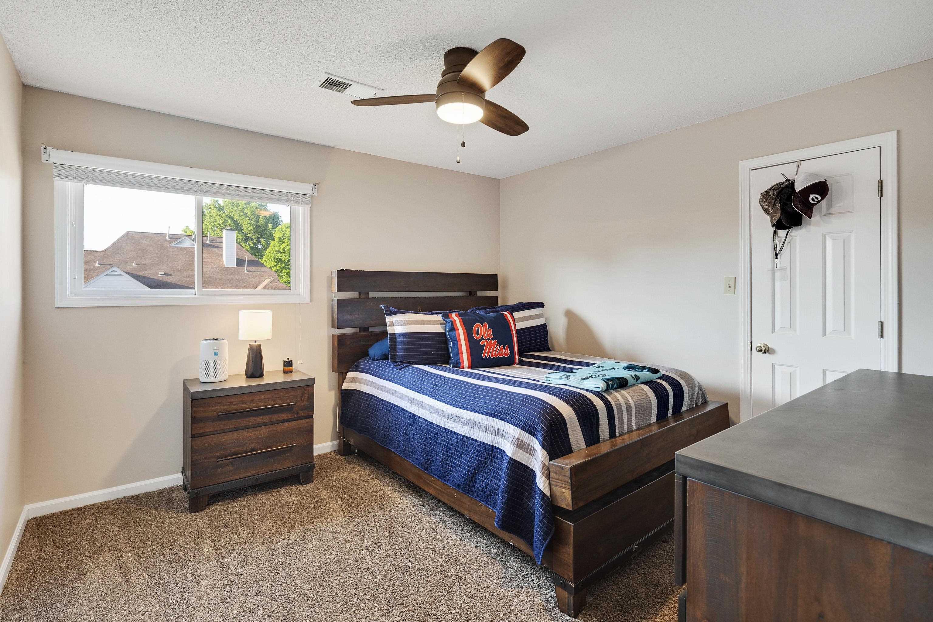 540 Whitney Way Collierville, TN 38017 - Photo 19 of 22 Carpeted bedroom with ceiling fan and baseboards