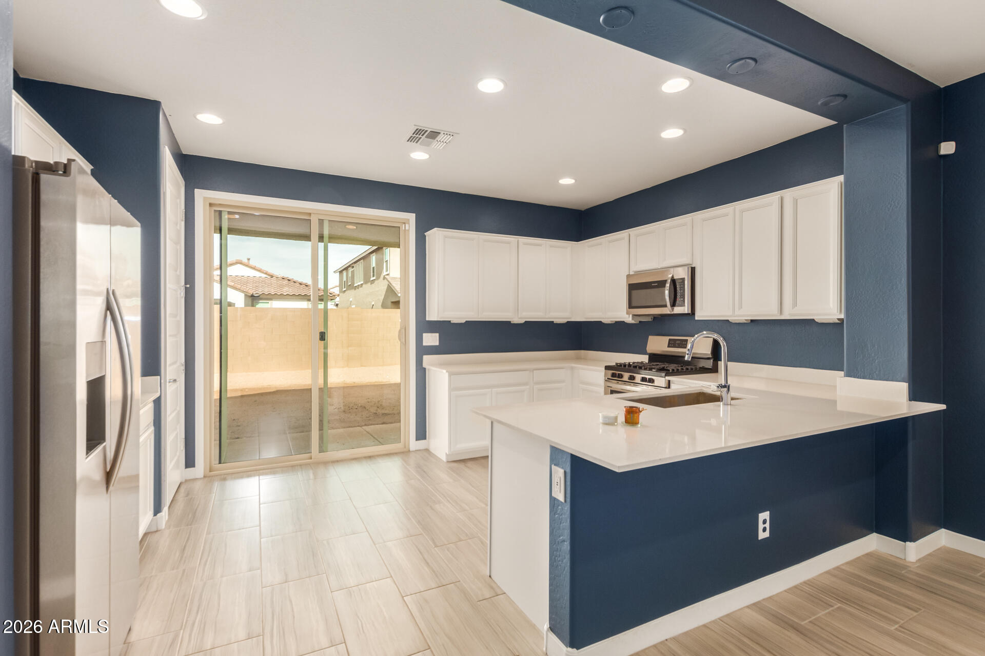 9210 West Roma Avenue Phoenix, AZ 85037 - Photo 4 of 23 Kitchen with Door to Backyard