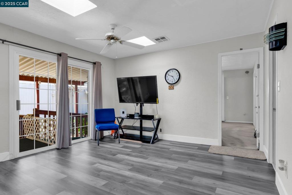 2113 Dalis Drive Concord, CA 94520 - Photo 10 of 22 a living room with furniture and a flat screen tv