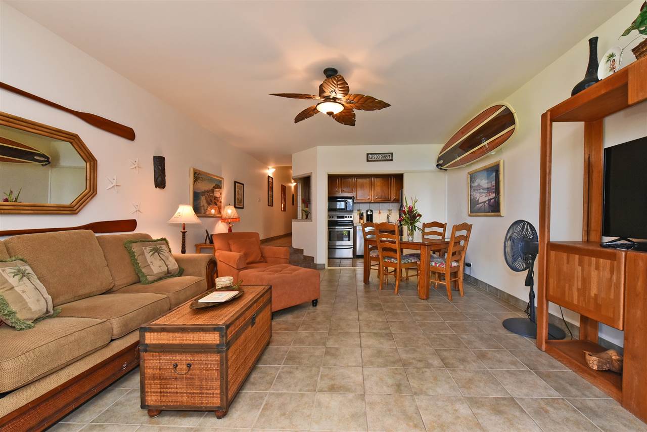 3875 Lower Honoapiilani Road, Unit B103 Lahaina, HI 96761 - Photo 13 of 30 a living room with furniture and a flat screen tv