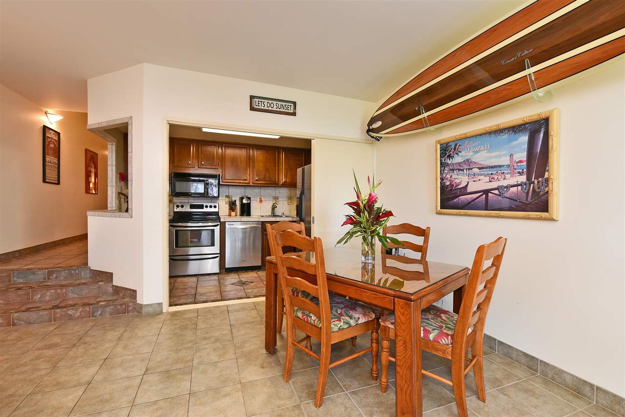 3875 Lower Honoapiilani Road, Unit B103 Lahaina, HI 96761 - Photo 15 of 30 a dining room with furniture and kitchen view