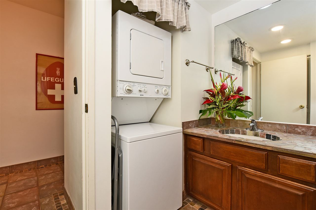 3875 Lower Honoapiilani Road, Unit B103 Lahaina, HI 96761 - Photo 25 of 30 a bathroom with a sink a toilet and mirror