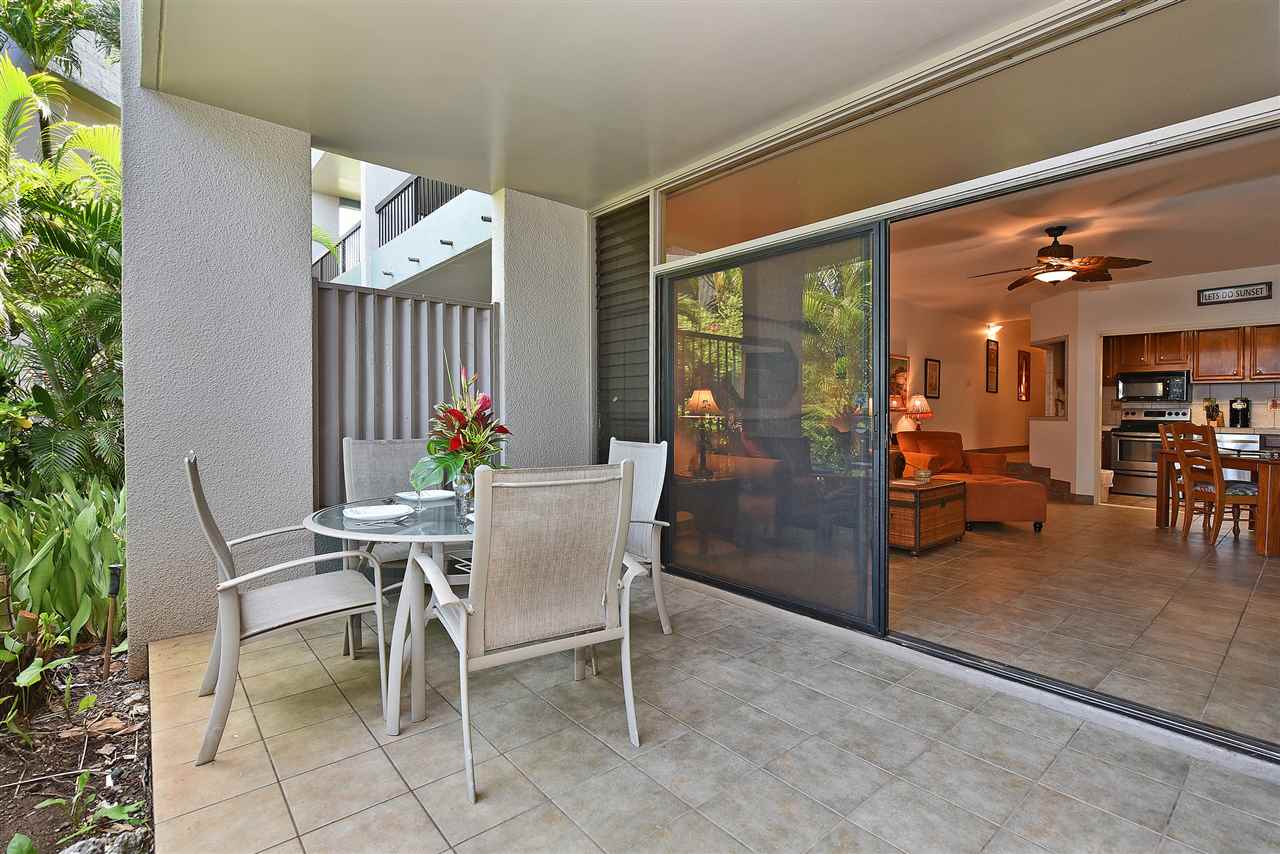 3875 Lower Honoapiilani Road, Unit B103 Lahaina, HI 96761 - Photo 4 of 30 a view of a dining room with furniture and a potted plant
