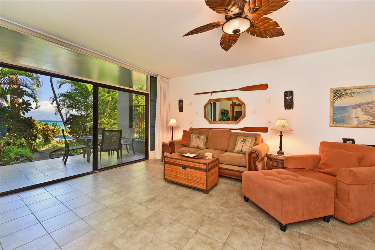 3875 Lower Honoapiilani Road, Unit B103 Lahaina, HI 96761 - Photo 8 of 30 a living room with furniture and a floor to ceiling window