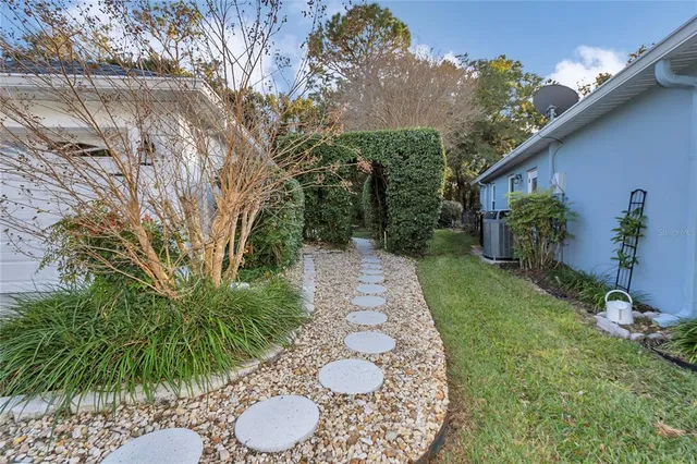 a view of a chair and table in backyard
