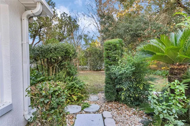 an aerial view of a house with outdoor space