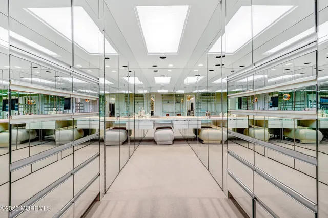 a lobby with furniture and a potted plant