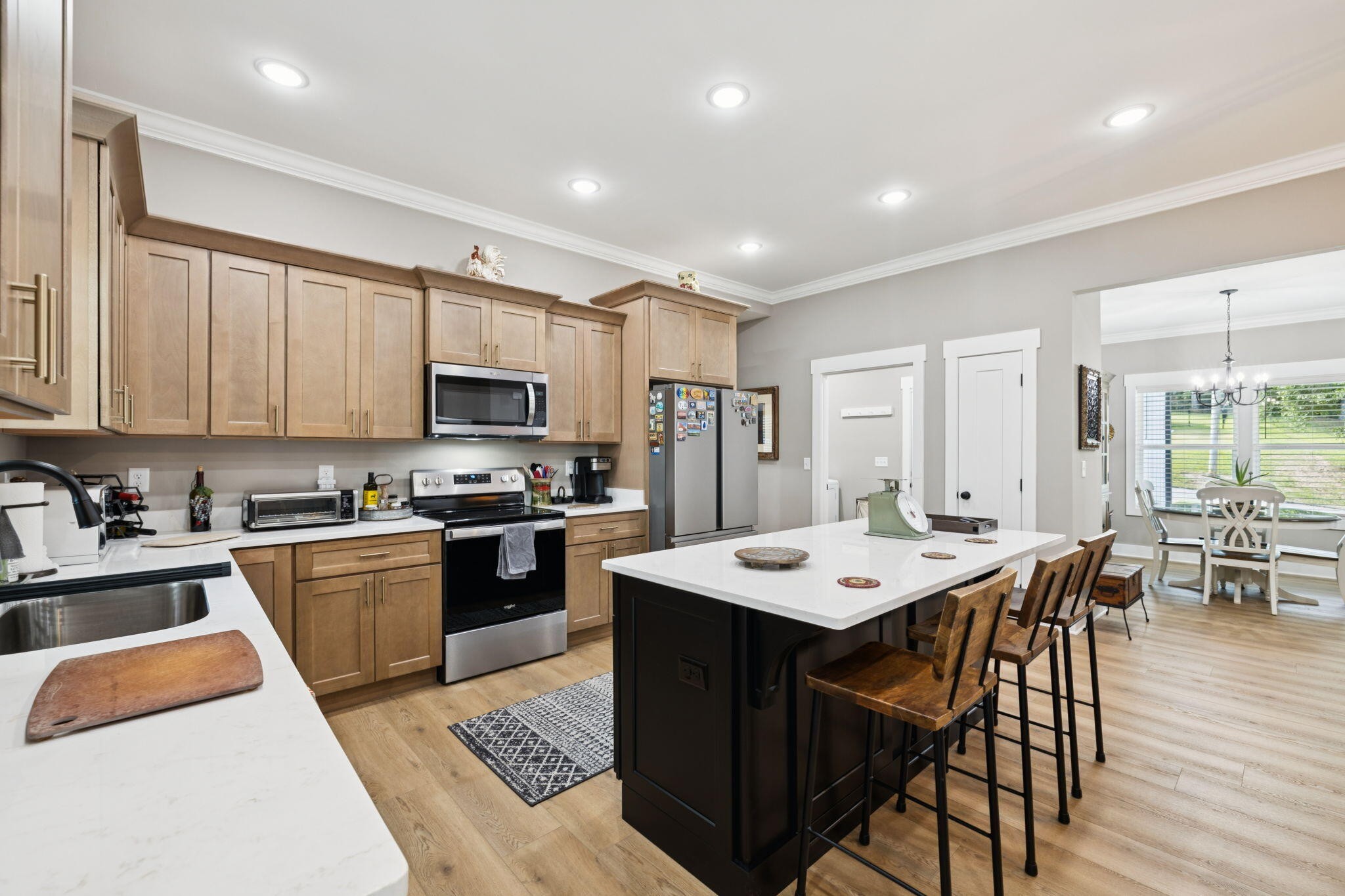 75 Battleview Drive Ringgold, GA 30736 - Photo 16 of 58 a kitchen with a stove a sink a dining table and chairs