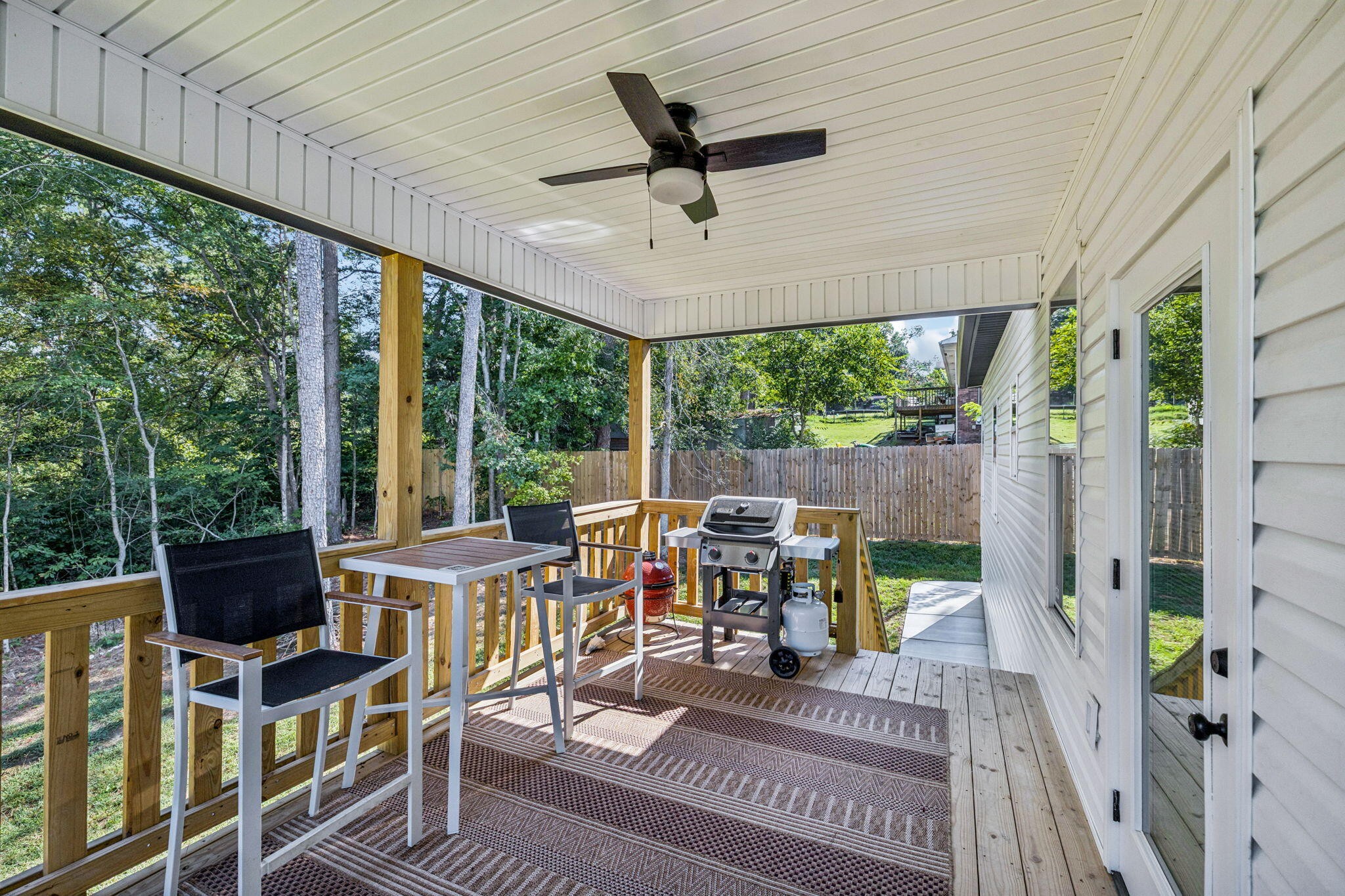 75 Battleview Drive Ringgold, GA 30736 - Photo 38 of 58 a view of a patio with table and chairs potted plants with floor to ceiling window