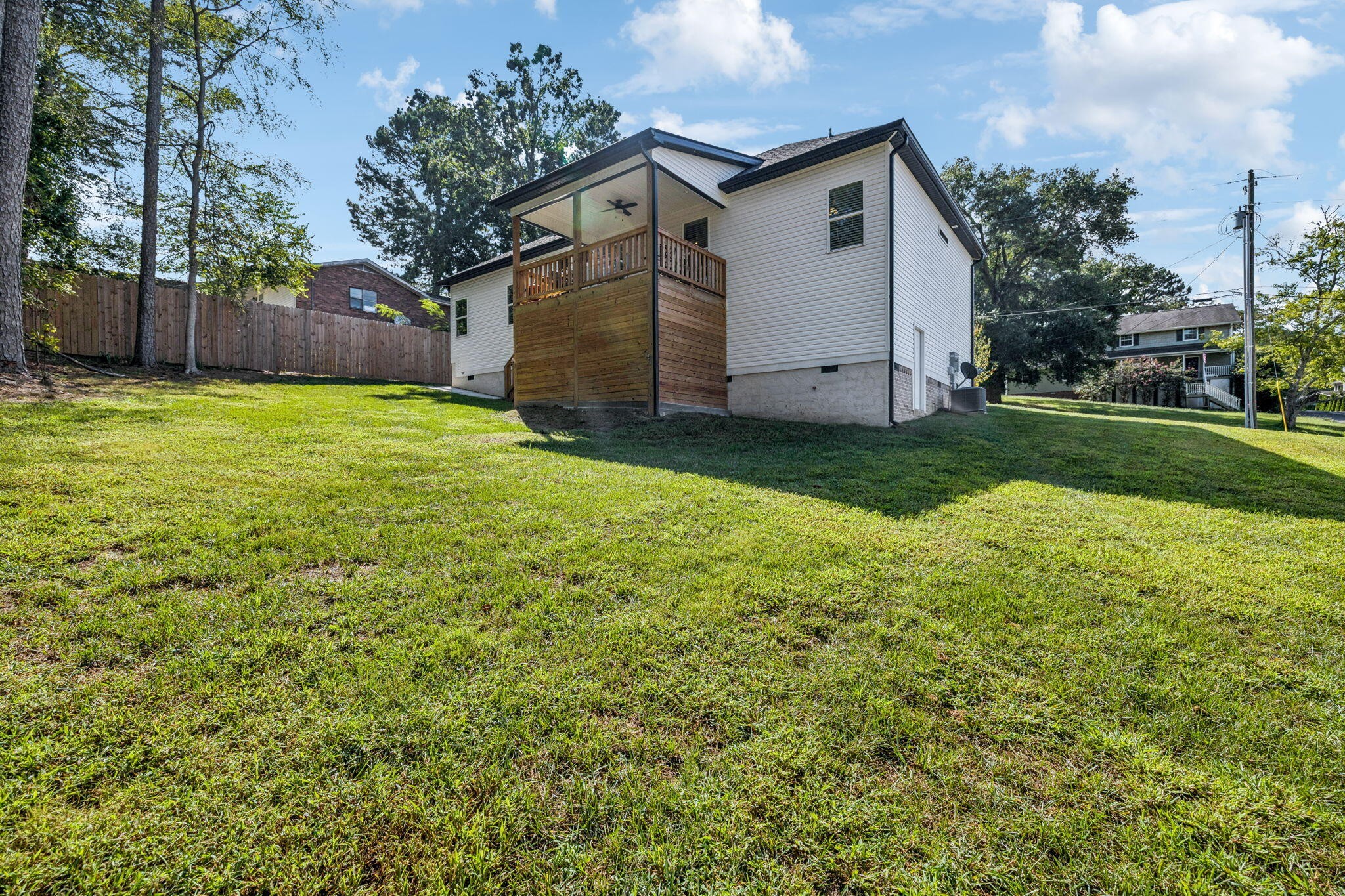75 Battleview Drive Ringgold, GA 30736 - Photo 44 of 58 a white house that has a small yard and wooden fence