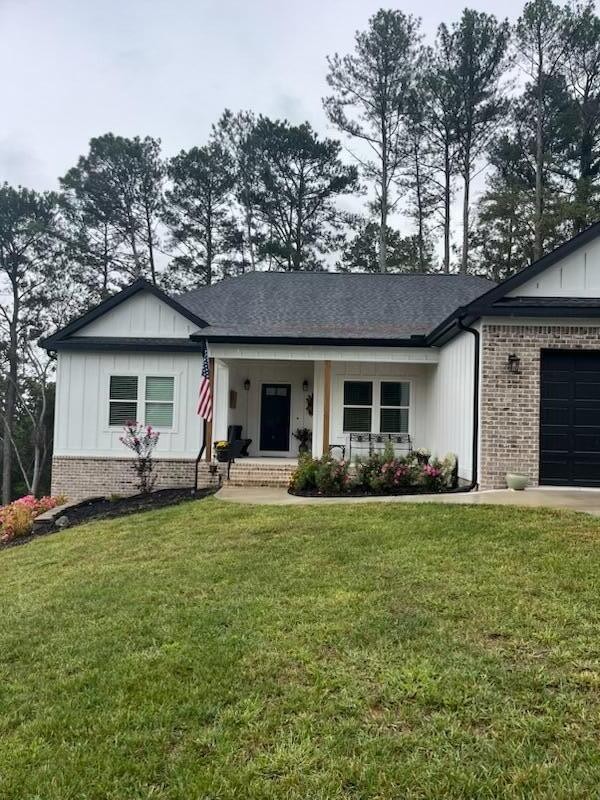 75 Battleview Drive Ringgold, GA 30736 - Photo 52 of 58 a front view of a house with a garden and porch