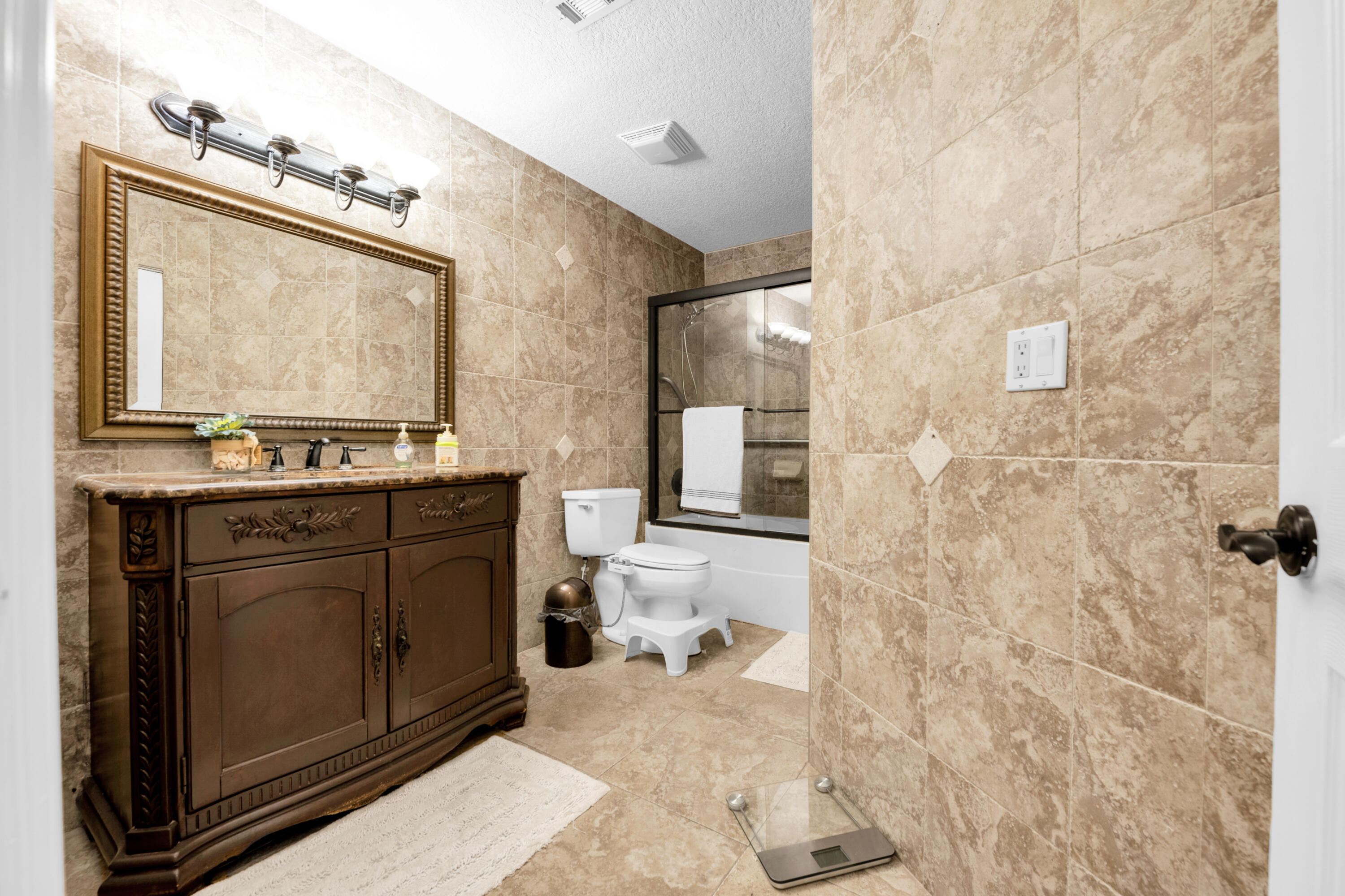 8440 Boca Glades Boulevard East Boca Raton, FL 33434 - Photo 9 of 16 a bathroom with a sink a vanity and a mirror