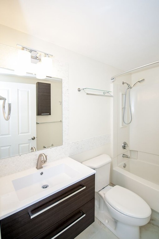 10 Museum Way, Unit 1521 Cambridge, MA 02141 - Photo 13 of 21 a bathroom with a sink a toilet and shower