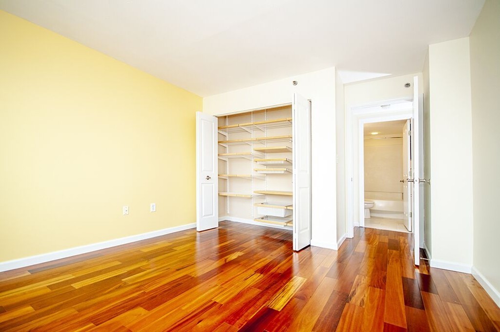 10 Museum Way, Unit 1521 Cambridge, MA 02141 - Photo 15 of 21 a view of empty room with wooden floor