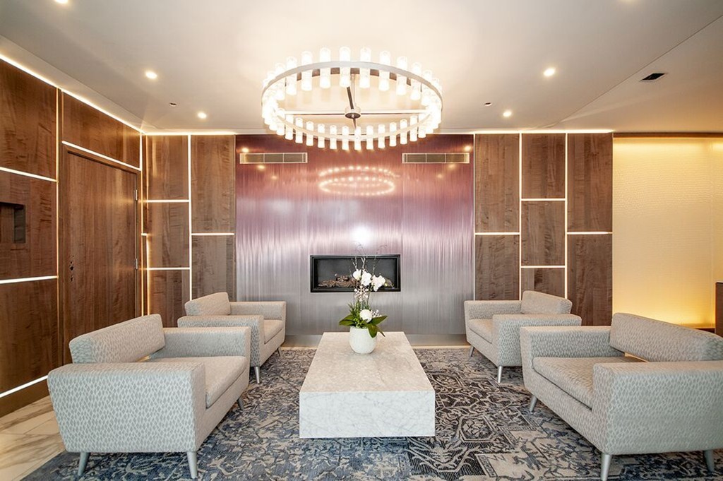 10 Museum Way, Unit 1521 Cambridge, MA 02141 - Photo 16 of 21 a living room with furniture and a chandelier