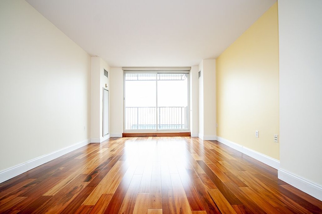 10 Museum Way, Unit 1521 Cambridge, MA 02141 - Photo 7 of 21 a view of an empty room with wooden floor