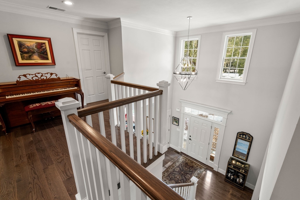 72 Moore Road Wayland, MA 01778 - Photo 14 of 23 a view of entryway with stairs and wooden floor