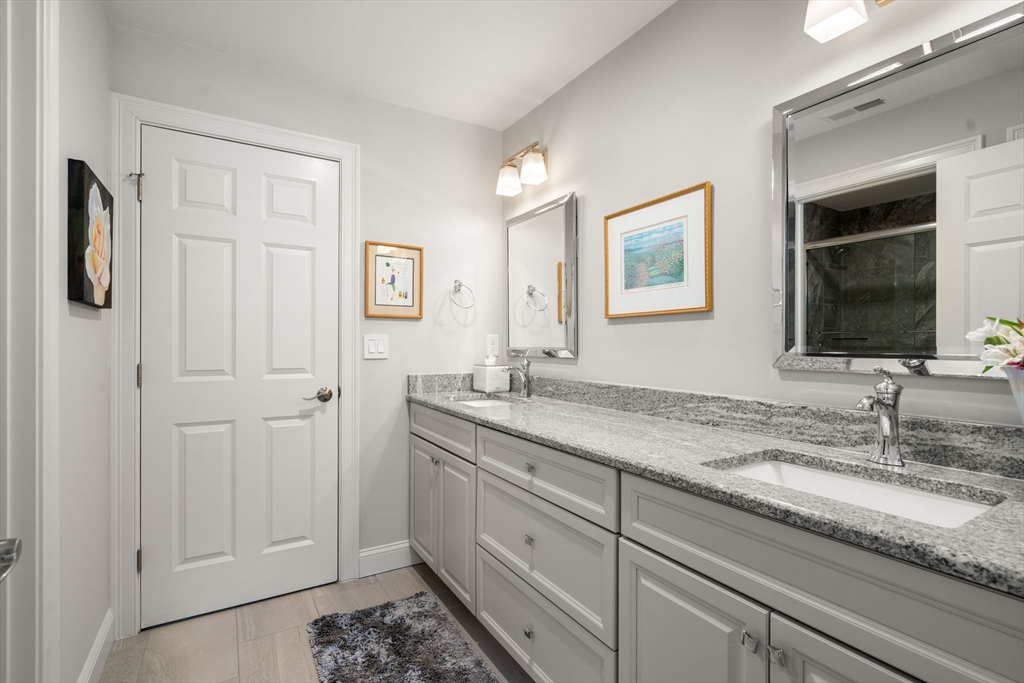 72 Moore Road Wayland, MA 01778 - Photo 19 of 23 a bathroom with a granite countertop sink and a mirror