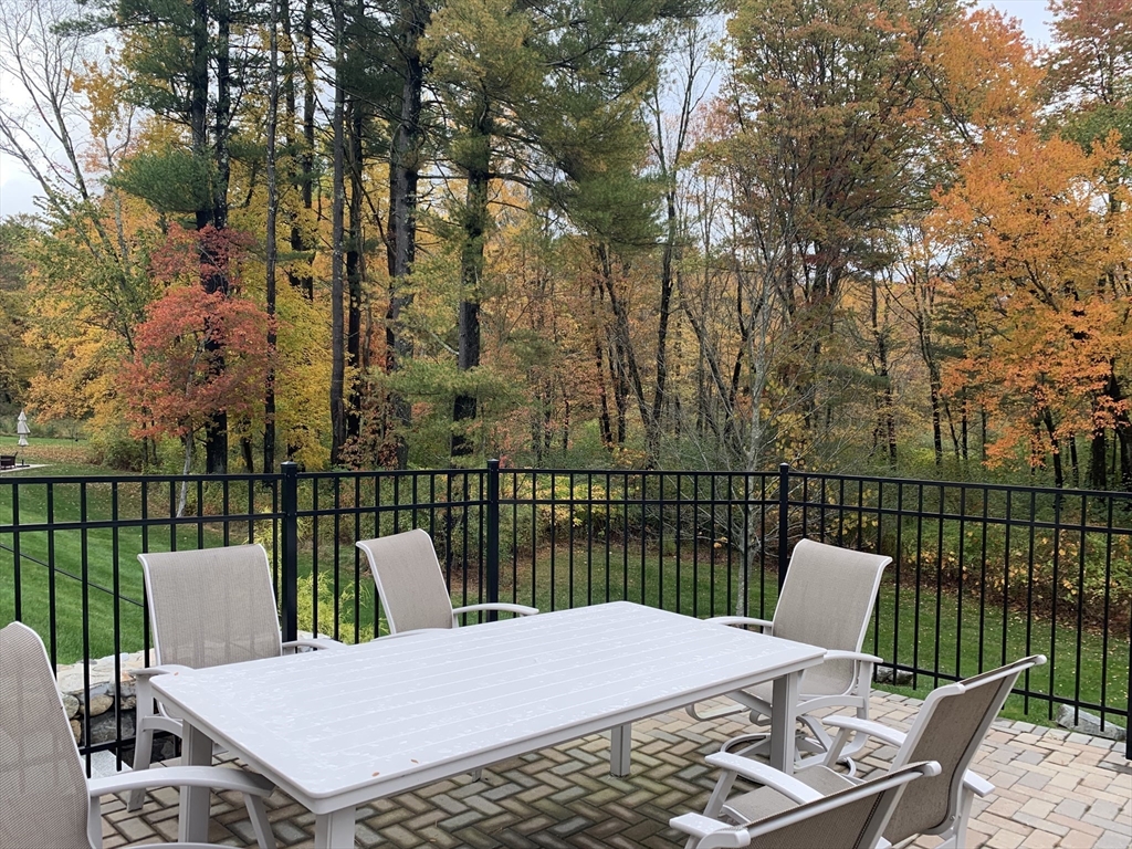72 Moore Road Wayland, MA 01778 - Photo 22 of 23 a view of a balcony with two chairs and a table