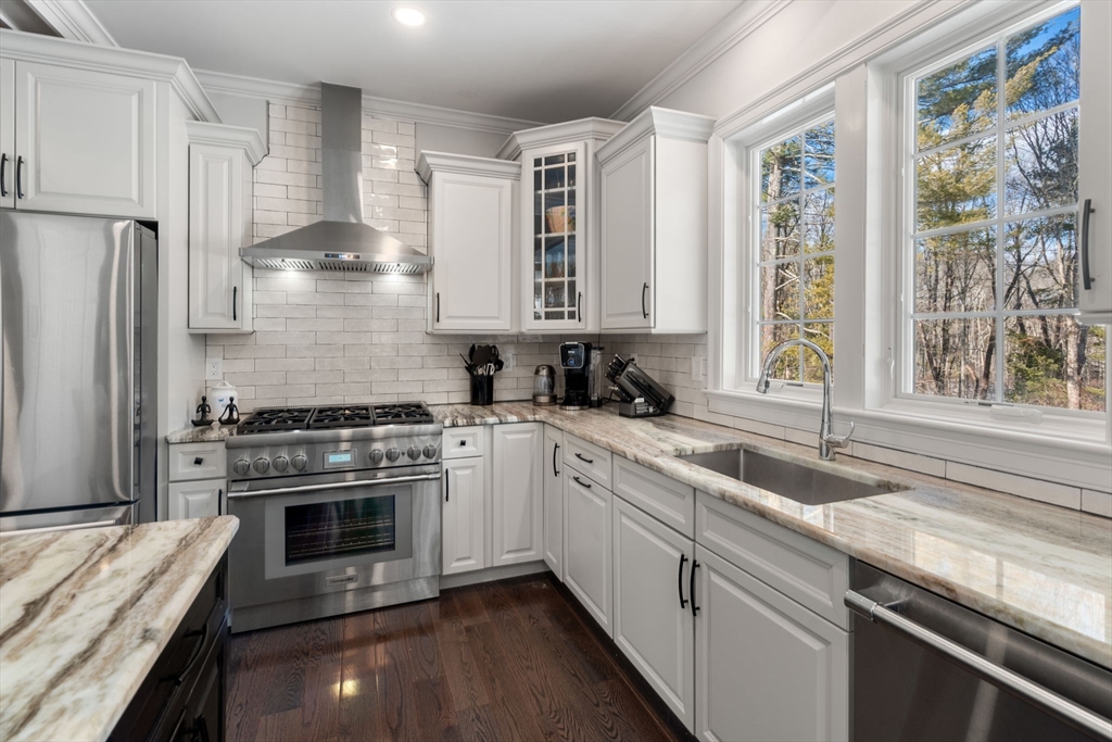 72 Moore Road Wayland, MA 01778 - Photo 8 of 23 a kitchen with a stove a sink and a refrigerator