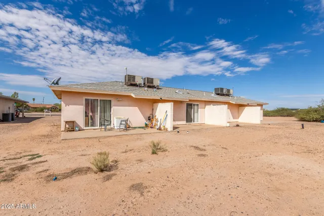 a view of a house with snow on the road