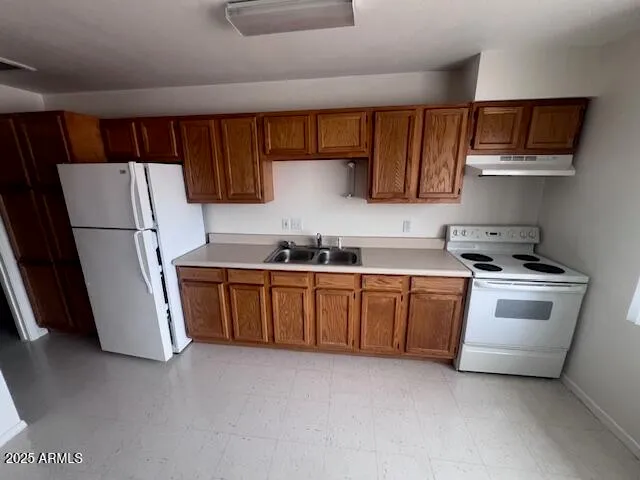 a bathroom with a tub sink and vanity