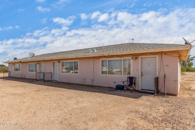 a backyard of a house with yard and garage