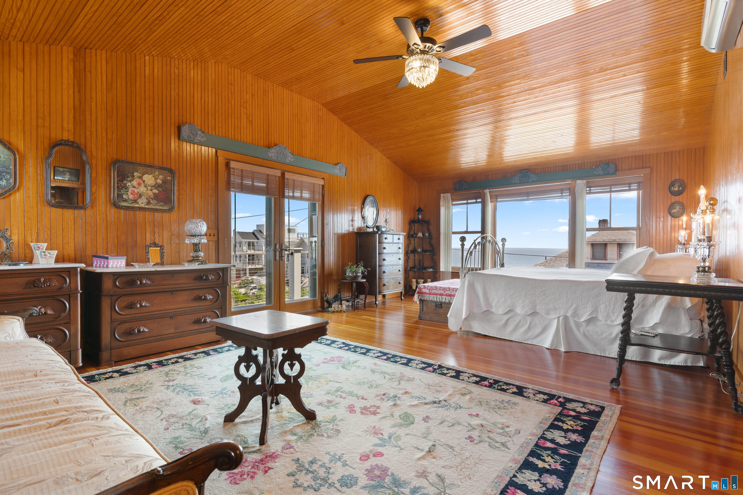 2 Minor Road East Haven, CT 06512 - Photo 21 of 36 a living room with couch and a dining table with wooden floor