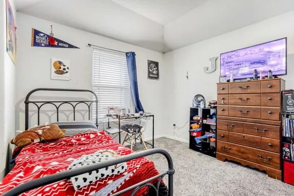 a bedroom with a bed and a closet