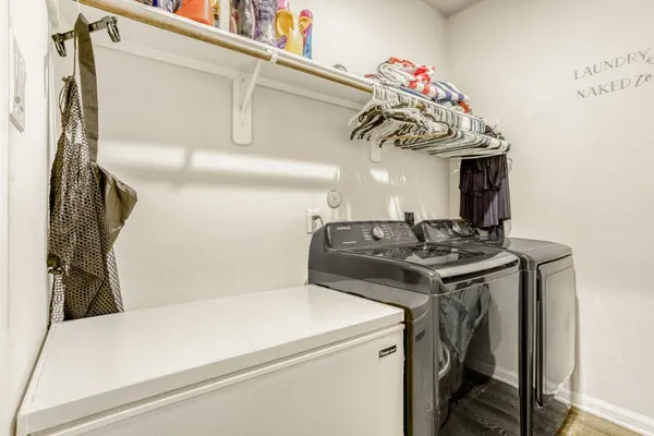 a utility room with dryer and washer