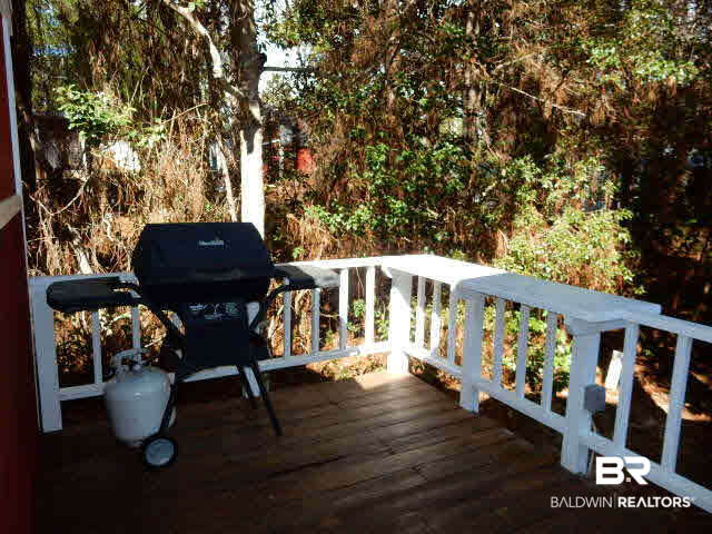 417 Maria Drive Lillian, AL 36549 - Photo 25 of 32 Deck to the side of the shed