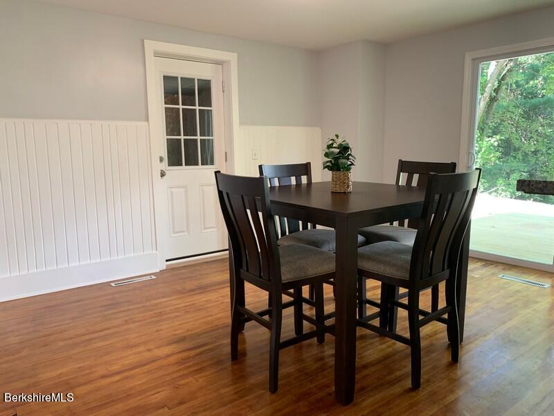 2312 State Road Richmond, MA 01254 - Photo 16 of 37 a view of a dining room with furniture and wooden floor