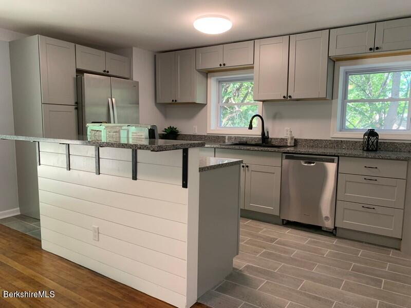 2312 State Road Richmond, MA 01254 - Photo 18 of 37 a kitchen with cabinets appliances a sink and a window