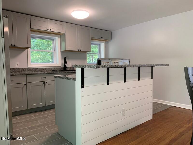 2312 State Road Richmond, MA 01254 - Photo 19 of 37 a kitchen with cabinets appliances a sink and a window