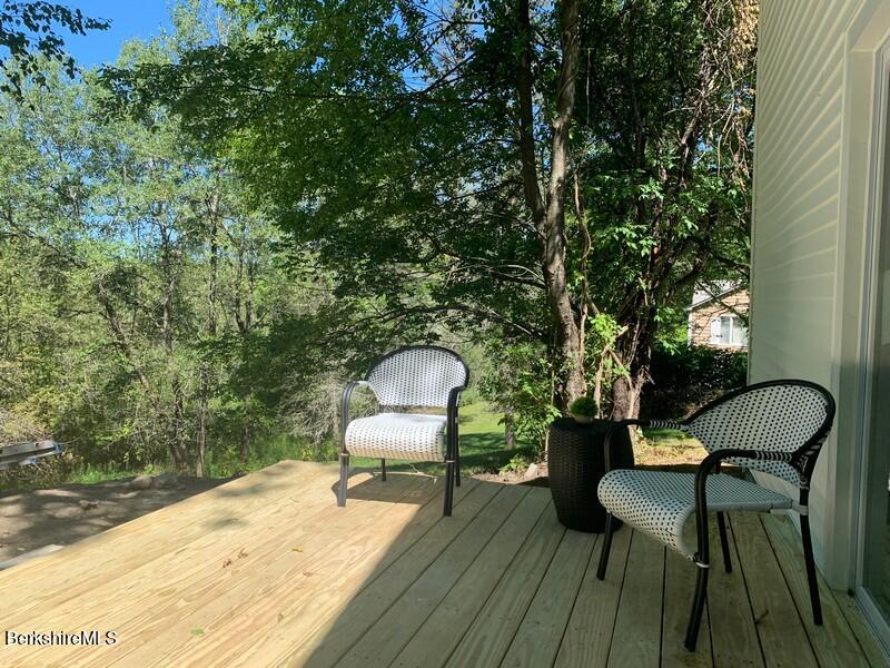 2312 State Road Richmond, MA 01254 - Photo 7 of 37 a backyard of a house with table and chairs