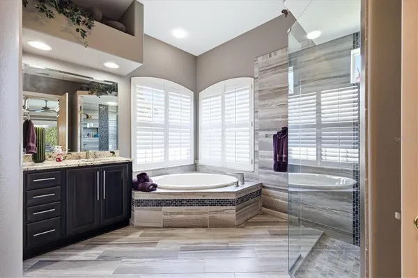 a bathroom with a bathtub and a sink